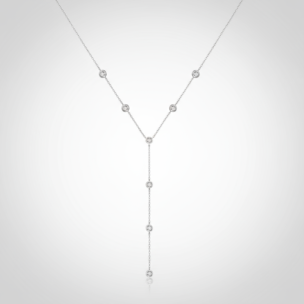Silver necklace with small beads on a white background