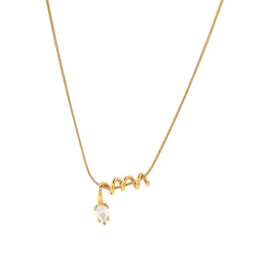 Gold necklace with a small pendant on a white background