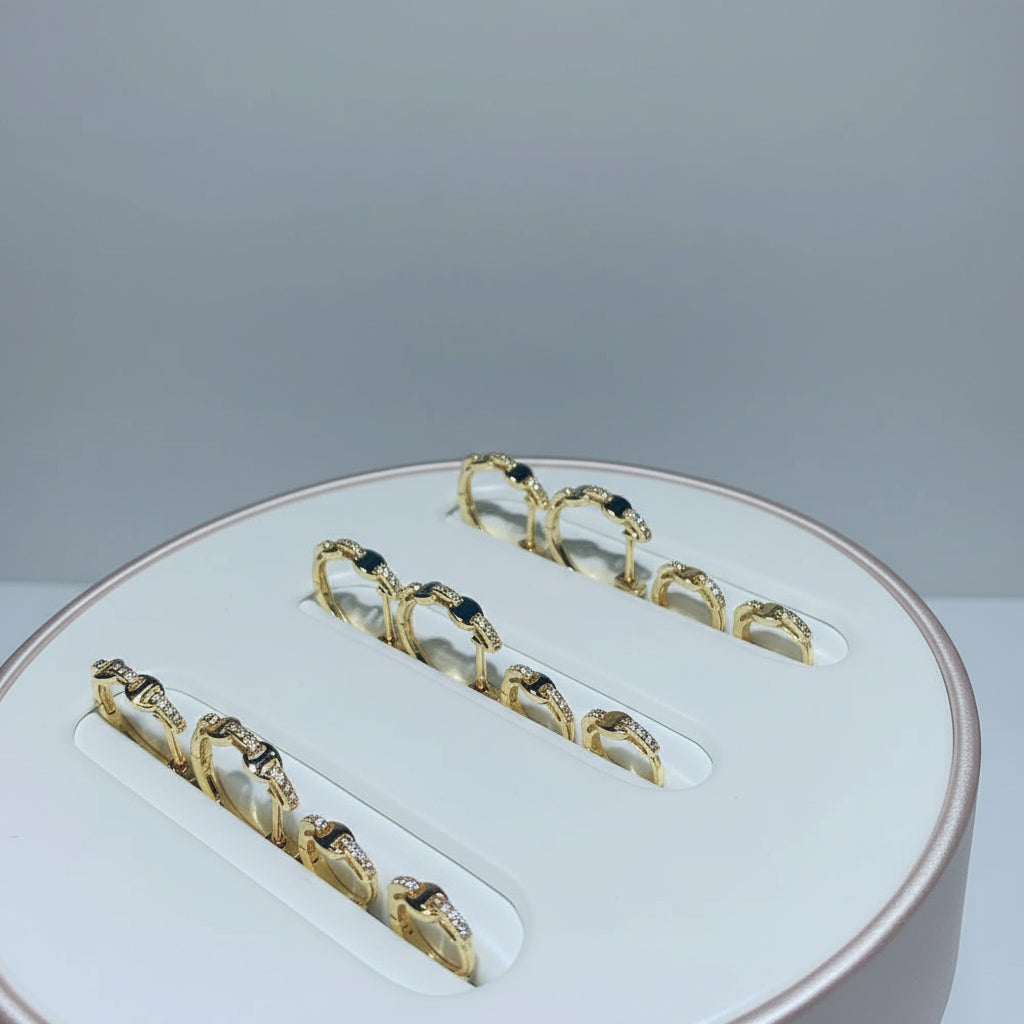 Gold dental jewelry set on a white tray with 'Shiny Jewelry' branding.