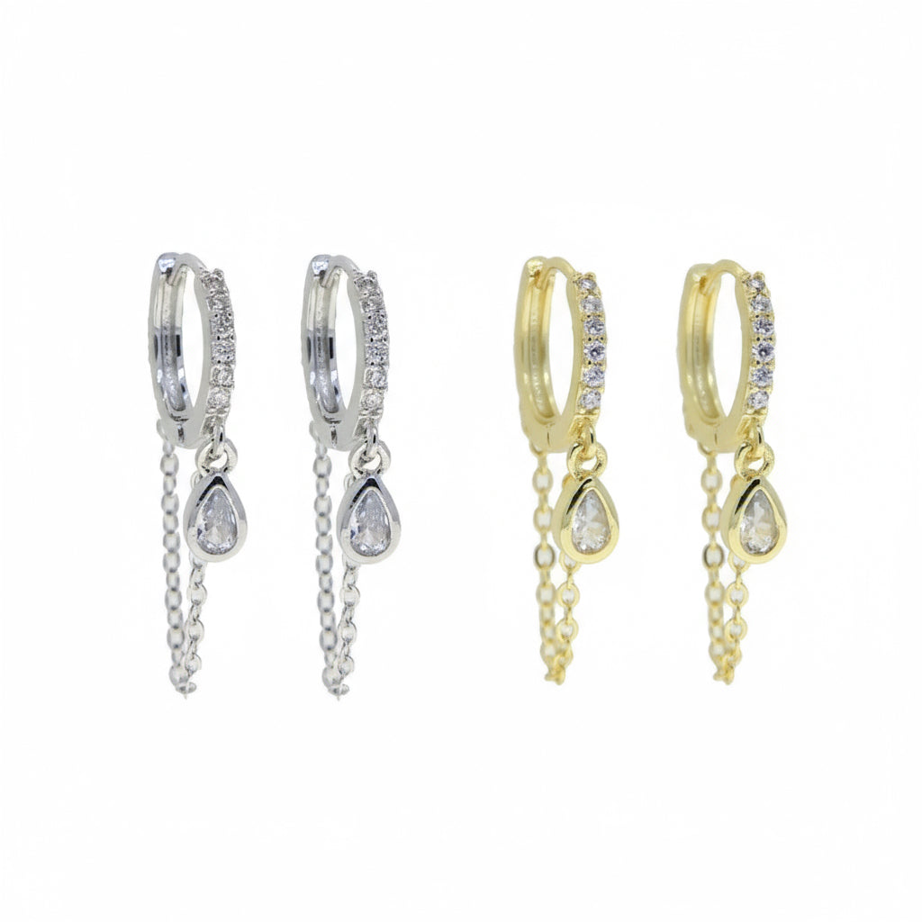 Pair of silver hoop earrings with teardrop-shaped charms on a white background