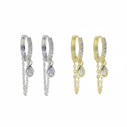 Pair of silver hoop earrings with teardrop-shaped charms on a white background