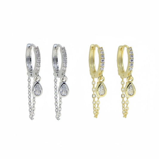 Pair of silver hoop earrings with teardrop-shaped charms on a white background