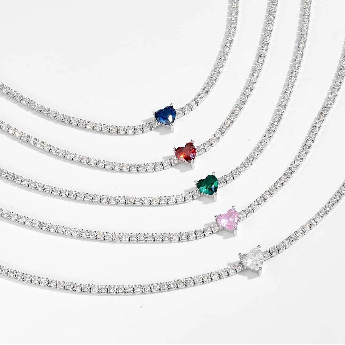 Set of diamond necklaces with colored gemstones on a white background, branded 'FUAMAY'.