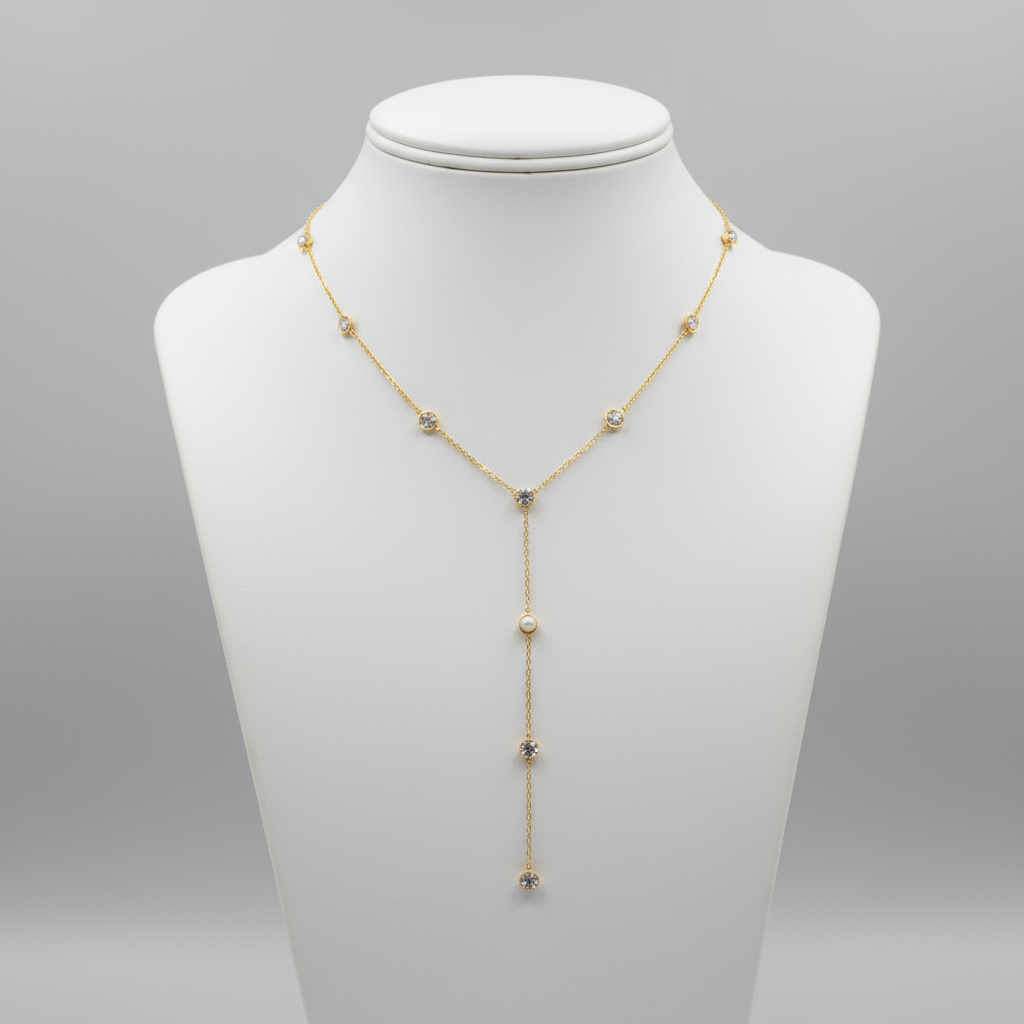Gold necklace with small stones on a mannequin