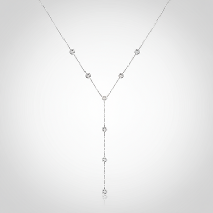 Silver necklace with small beads on a white background