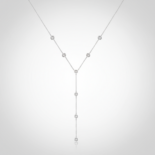 Silver necklace with small beads on a white background